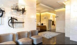 a lobby with chairs and a table in a room at فندق فاتوران 2 in Medina