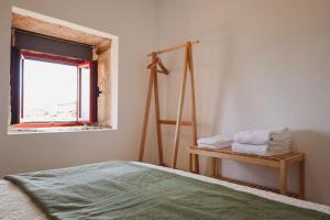 a bedroom with a bed and a window at Douro Feels Like Home in Fontelo