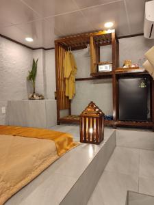a bedroom with a bed and a flat screen tv at THE NAM DU HILL resort in Nam Du