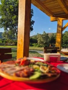 a plate of food sitting on a table at Glamping Lake Escape in Virpazar
