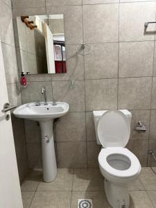 a bathroom with a toilet and a sink at Casa del Arte in Salta +42 photos