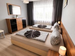 a bedroom with two beds and a window at Pension Reiter in Blomberg +50 photos