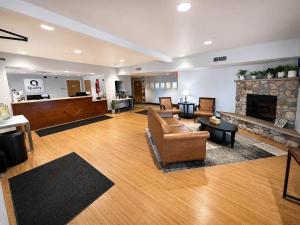 a living room with a couch and a fireplace at Quality Inn & Suites Sequim at Olympic National Park in Sequim