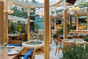 a restaurant with tables and chairs and a fountain at ARIA Resort & Casino in Las Vegas