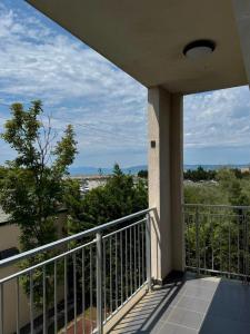 a balcony of a house with a view at Rrode Apartment Tale Beach in (( Shën Ded Gjoni ))