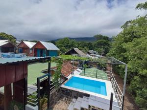 an aerial view of a house with a tennis court at Lazy Crab Hostel in Balgue