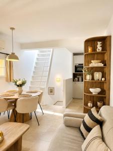 a living room with a couch and a table at Charming house with rooftop - Gassin in Gassin