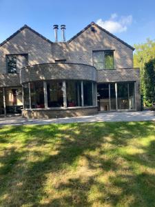 a large house with a lawn in front of it at Magnolia in Wuustwezel