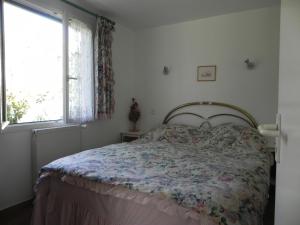Postel nebo postele na pokoji v ubytování B&B Le clos des vignes Saint Raphael