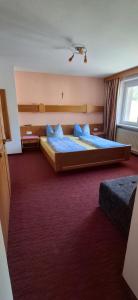 a hotel room with two beds and a window at Haus Jirka in Nauders