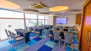 a conference room with tables and chairs and a screen at Hotel InterContinental Cartagena by IHG in Cartagena de Indias +204 photos