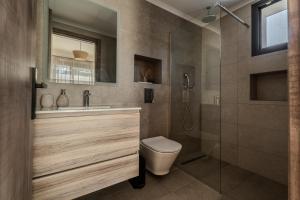 a bathroom with a toilet and a shower at AnaRose Zante Villa-by Sakis and Sam in Planos +33 photos