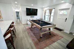 a room with a pool table and a flat screen tv at Private Pool Near Guitar Hotel & Beach in Hollywood