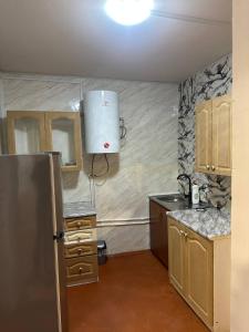 a kitchen with a stainless steel refrigerator in it at Tsovazard Life Lake in Tsovazard