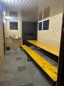 a room with two wooden benches in a room at Tsovazard Life Lake in Tsovazard