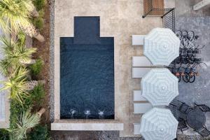 an overhead view of a swimming pool in a backyard at The Nicholas Veranda King Suite - Steps to King in Charleston