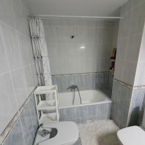 a bathroom with a tub and a toilet and a sink at El Burgo Eclipse Retreat in El Burgo de Osma +5 photos