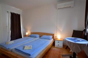 Postel nebo postele na pokoji v ubytování Apartment Akaju