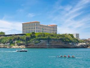 a group of people in a boat in the water at Ibis Budget Marseille Vitrolles in Vitrolles