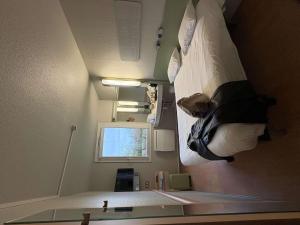 a hospital room with a bed hanging from the wall at ibis budget Granville in Granville +88 photos