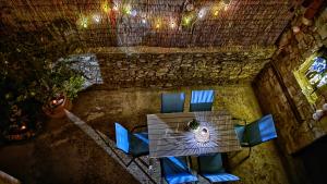 a table and chairs in a room at Mendy Sea View Apartment in Kaštela +45 photos