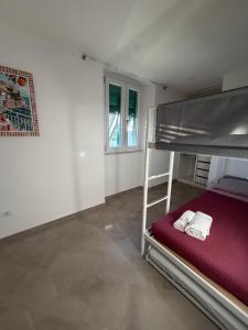 a bedroom with a bunk bed in a room at A Casa di Gaia 2 in San Benedetto