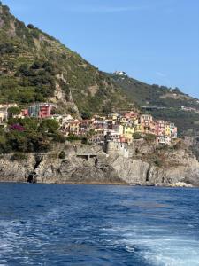 a group of houses on a hill next to the water at A Casa di Gaia 2 in San Benedetto