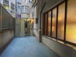 an alley with an open door in a building at Apartamento en A Coruña in A Coruña