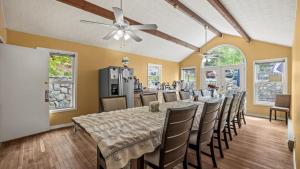 a dining room with a long table and chairs at Black Bear Manor in Ouray