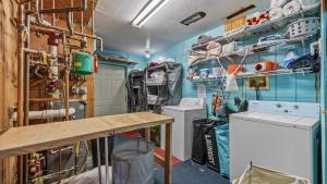 a laundry room with two washer and dryer at Black Bear Manor in Ouray +94 photos