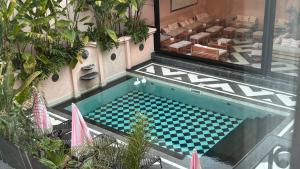 an overhead view of a swimming pool in a building at Le Flâneur Boutique Hotel in Pergamino