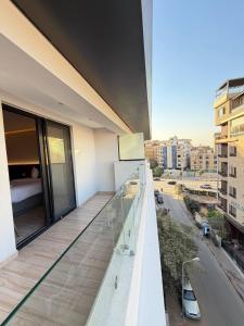 a balcony of a building with a view of a city at Grand Museum Pyramids in Cairo
