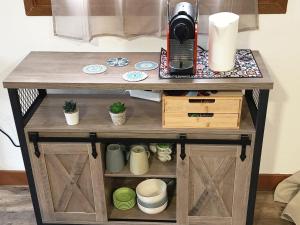 a table with a coffee maker on top of it at L'Escapade Vierzonnaise in Vierzon