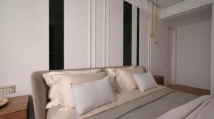 a white bed with white pillows in a room at La Dolce Sosta in Venice