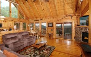 a living room with a couch and a fireplace at Calis Place in Sevierville