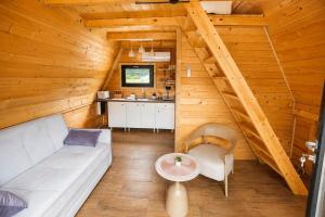 a living room with a couch and a table at Rzav A - Frames in Arilje