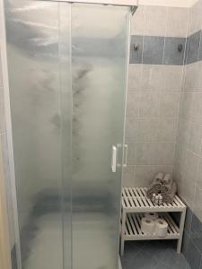 a shower with a glass door in a bathroom at Al Vicolèt in Vercelli +13 photos
