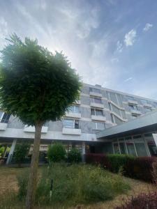 a large building with a tree in front of it at Casa Soden, Artful living close to Frankfurt in Bad Soden am Taunus