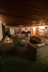 a large living room with couches and a table at Karrizo lodge in San Pedro de Atacama
