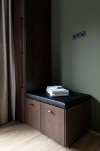 a room with a bench with a towel on it at Modern Cabin with Hot Tub & Mountain views in Varmaland +30 photos