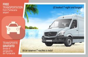 a white van parked on the beach next to the water at FIESTA DEL CARIBE - LOS CORALES beach in Punta Cana