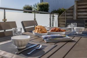 a table with two plates of food on it at residence kersailliou in Roscoff