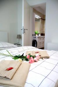 a bedroom with two beds with flowers on it at Apartman Deluxe Astrova B in Bratislava