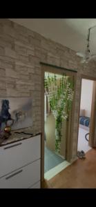 a kitchen with a vase with a plant in it at Tanger in Tangier