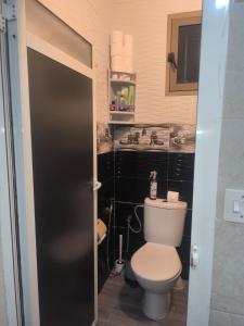 a bathroom with a toilet and a sink at Sara guest house in Agadir