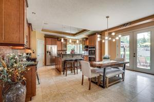 a kitchen with a table and chairs and a dining room at Private Getaway! Massive Springfield Area Home in Rogersville