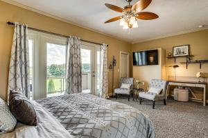 a bedroom with a bed and a large window at Private Getaway! Massive Springfield Area Home in Rogersville +37 photos