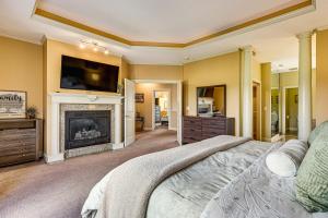 a bedroom with a fireplace and a tv on the wall at Private Getaway! Massive Springfield Area Home in Rogersville