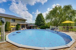 a large swimming pool on a wooden deck at Private Getaway! Massive Springfield Area Home in Rogersville