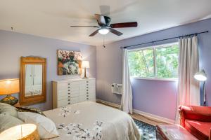 a bedroom with a bed and a ceiling fan at Walk to Downtown Chico! Tree-Lined Apt w/ Deck in Chico